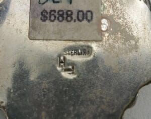 Sterling silver item with price tag.