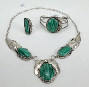Green gemstone jewelry set with silver accents.