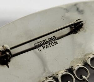 Sterling silver jewelry with "I. Paton" inscription.