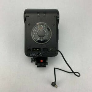 Camera flash with attached cable on white.