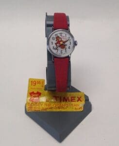 Red strap watch with cartoon character display.