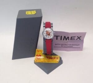 Timex watch with red strap and packaging.