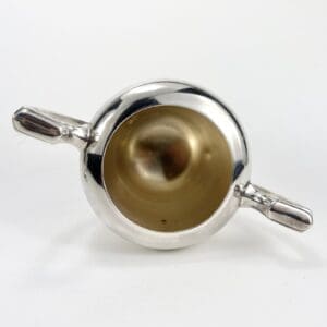 Silver bowl with handles, top view.