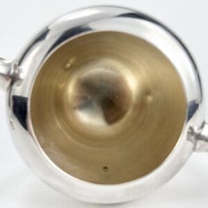 Silver and gold two-handled cup interior.