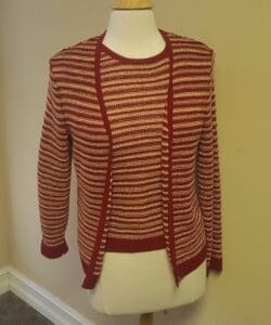 Red and white striped cardigan on mannequin.