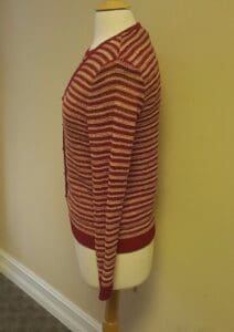 Red striped sweater on a mannequin.