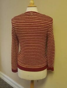 Red and white striped sweater on mannequin.