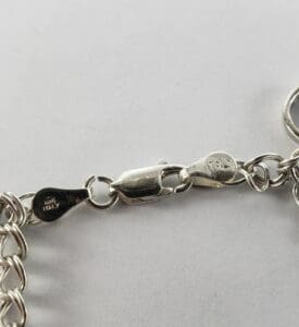 Silver necklace clasp with Italy hallmark stamp.