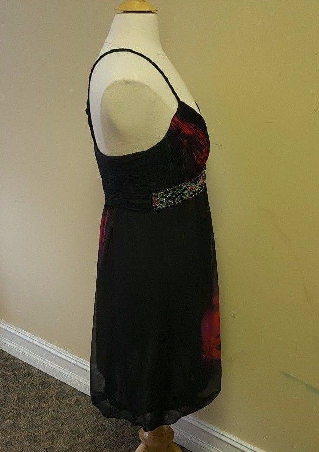 Black and red dress on mannequin.