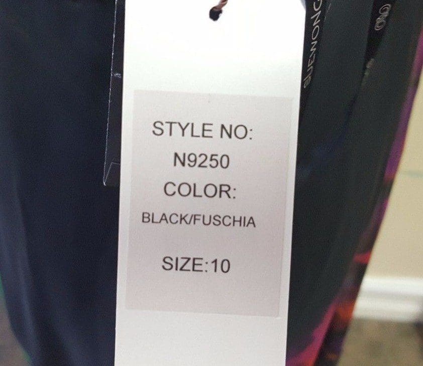 Clothing tag with style, color, size details.