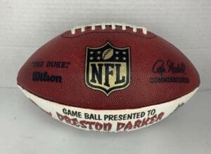 NFL football presented to Preston Parker.