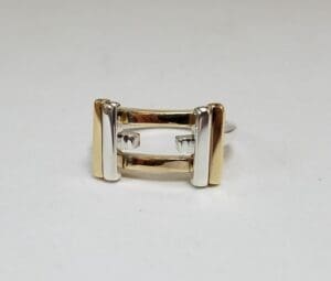 Two-tone metal ring on white background.