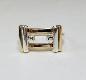 Gold and silver geometric ring design.