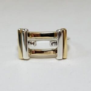 Gold and silver geometric ring design.