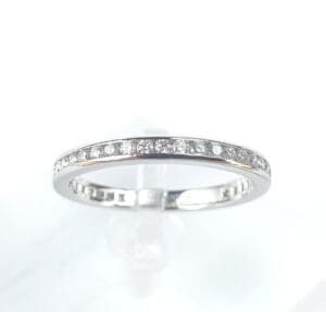 Silver ring with embedded diamonds.