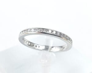 Silver ring with embedded diamonds.