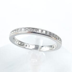Silver ring with embedded diamonds.