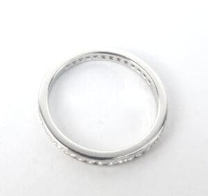 Silver ring with engraved interior pattern.