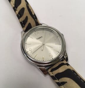 Timex watch with animal print strap.
