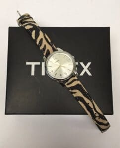 Zebra-patterned Timex watch on box.