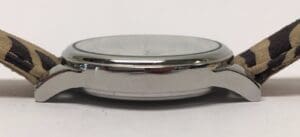 Side view of watch with patterned strap.