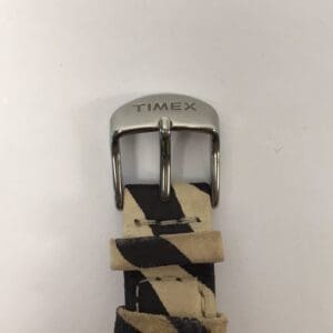 Timex watch buckle with striped strap.