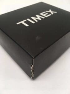Black Timex box on white surface.