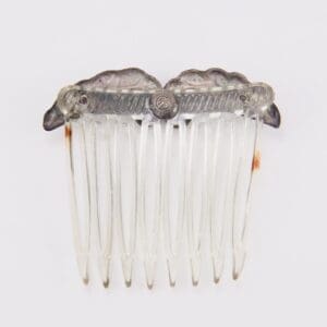 Decorative clear plastic hair comb accessory.