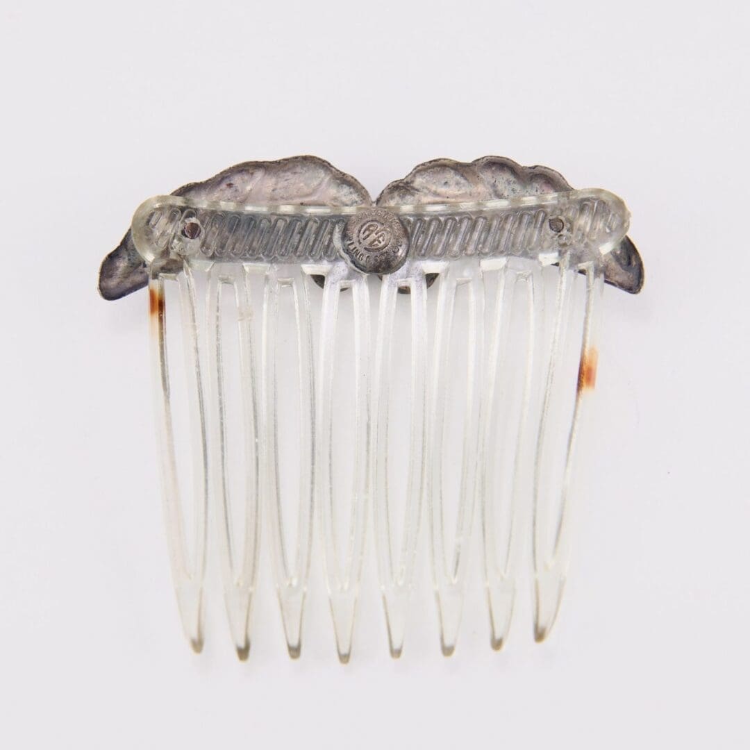 Decorative clear plastic hair comb accessory.