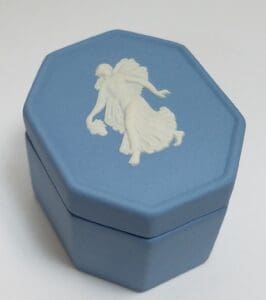 Blue octagonal box with white relief design.