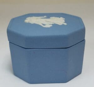 Blue octagonal box with white relief design.