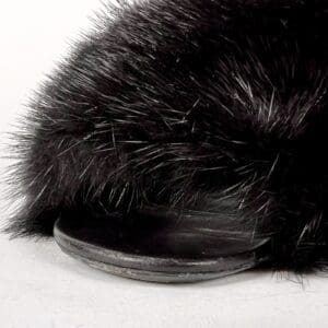 Black fur hat on white background.