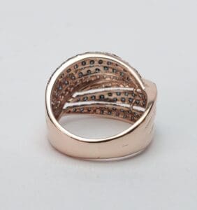 Gold ring with embedded blue gemstones.