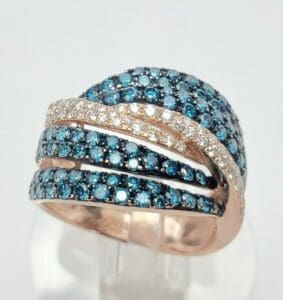 Gold ring with blue and white gemstones.