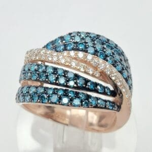 Gold ring with blue and white gemstones.