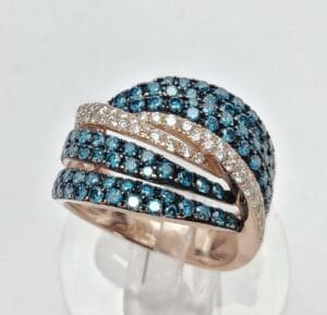 Gold ring with blue and white stones.