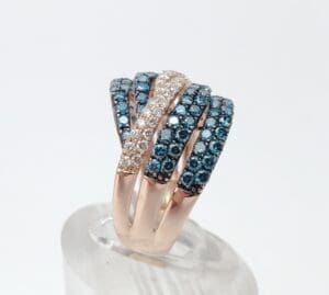 Gold ring with blue and clear stones.