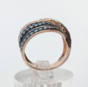 Rose gold ring with blue gemstones.