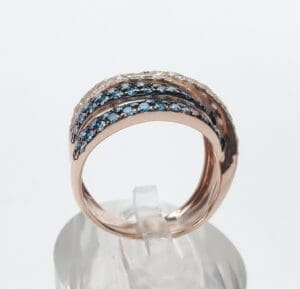 Rose gold ring with blue gemstones.