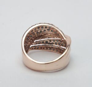 Gold ring with embedded blue gemstones.