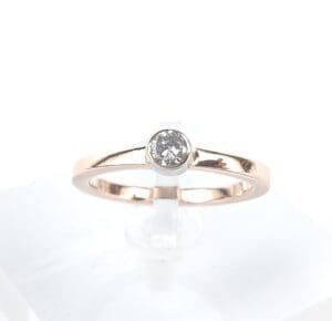 Gold ring with a single diamond.