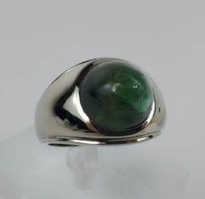 Silver ring with a green gemstone.