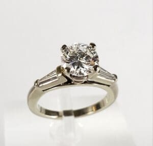 Diamond ring with baguette side stones.