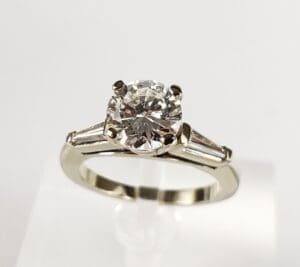 Diamond engagement ring with silver band.