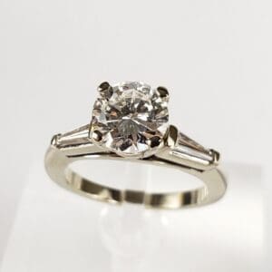 Diamond engagement ring with silver band.