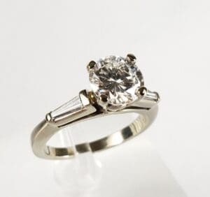 Diamond engagement ring with baguette accents.