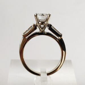Gold ring with a large diamond solitaire.