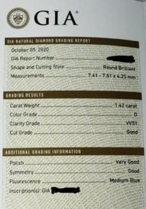 GIA diamond grading report with specifications.