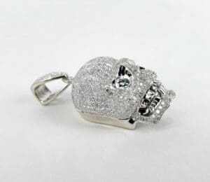 Diamond-encrusted skull pendant on display.