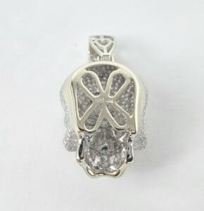 Diamond-encrusted skull pendant, intricate design.